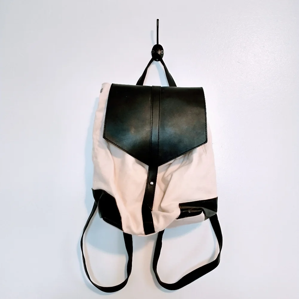 Deux Lux beige and black faux leather mini bag with buttons on the side to expan